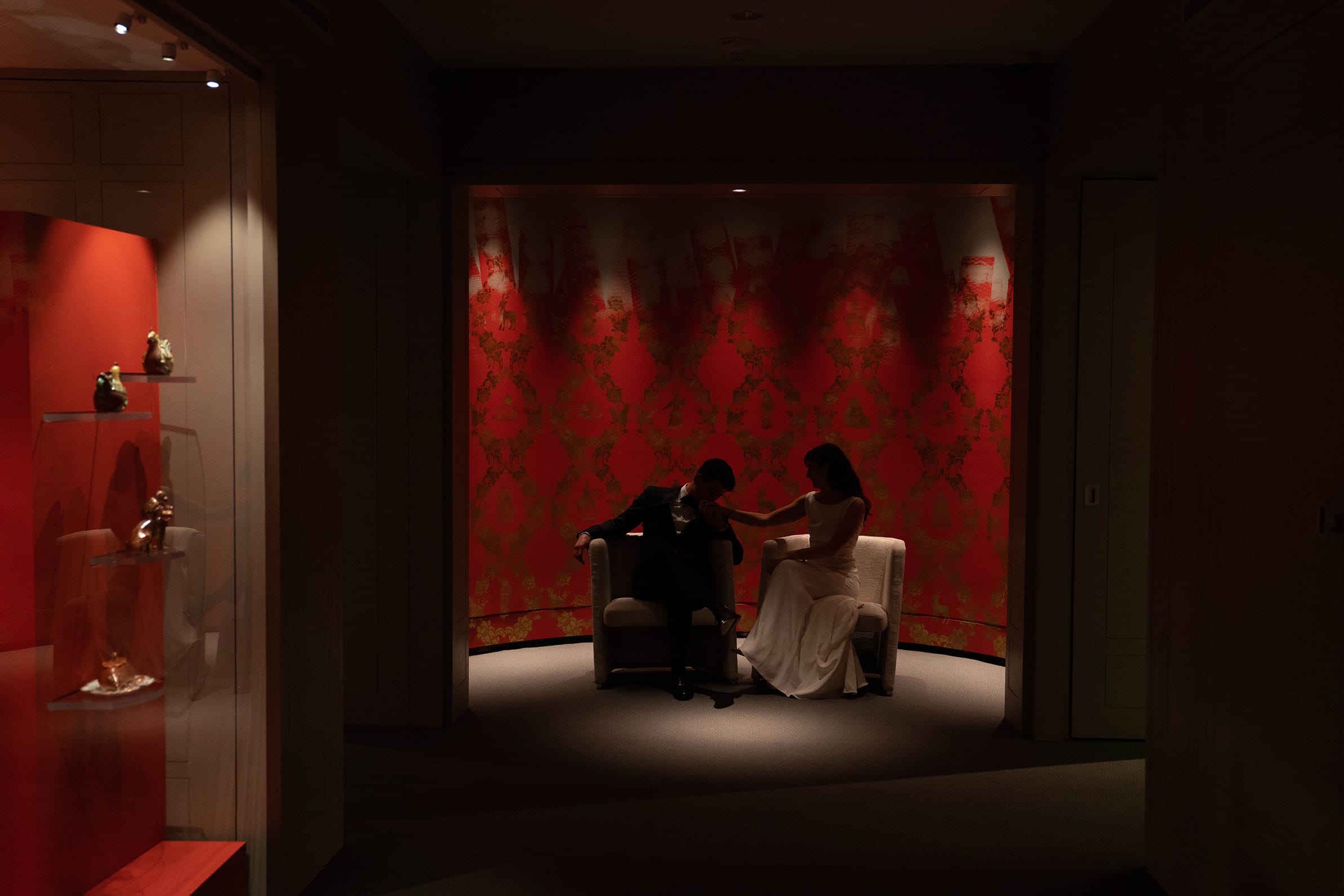 A documentary photograph featured in the best of wedding photography of 2019 showing a bride and groom sharing an intimate moment at the Peabody Essex Museum