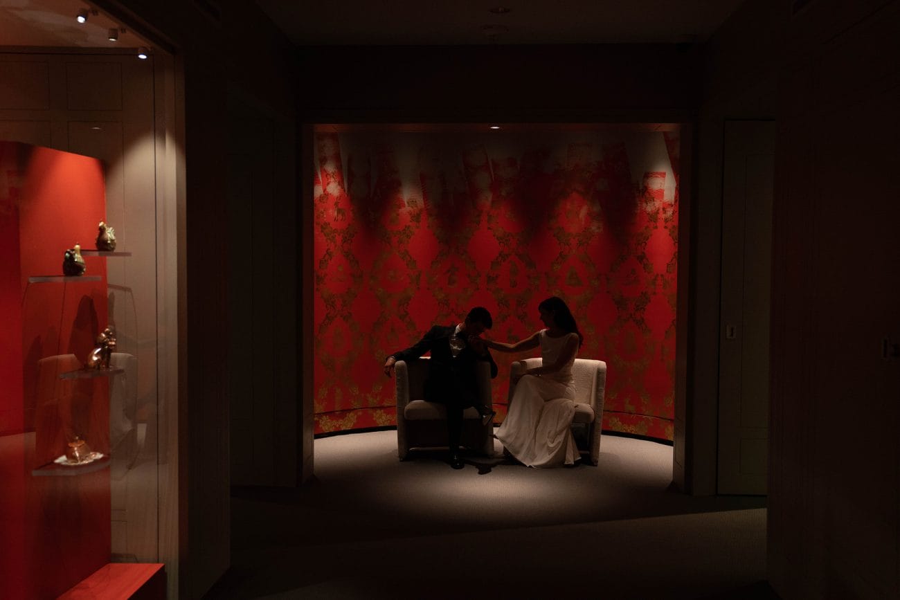 A documentary photograph featured in the best of wedding photography of 2019 showing a bride and groom sharing an intimate moment at the Peabody Essex Museum 