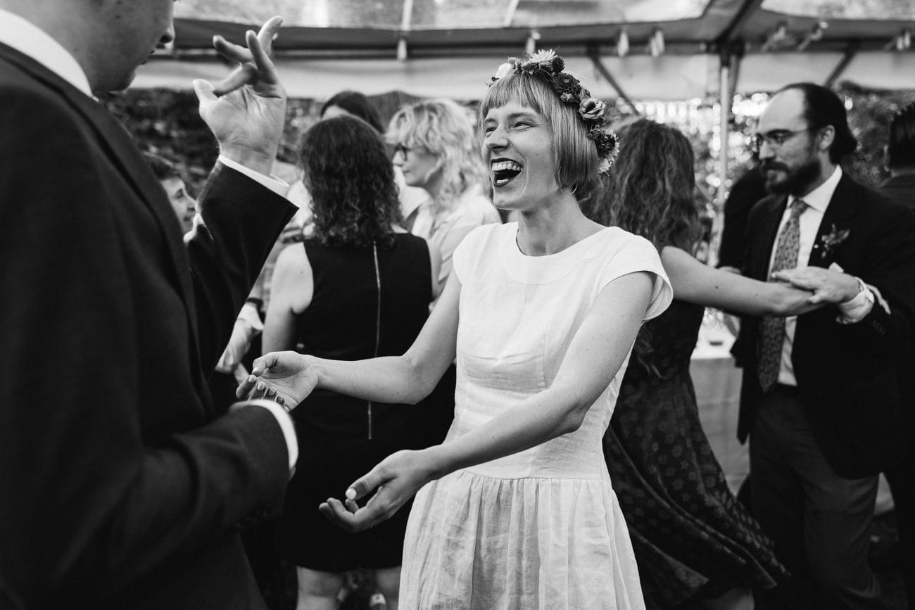 A documentary photograph featured in the best of wedding photography of 2019 showing a bride and groom dancing