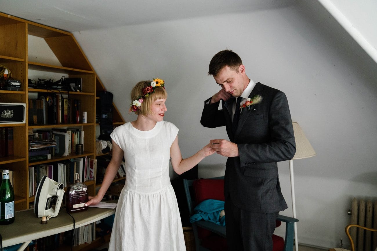 A documentary photograph featured in the best of wedding photography of 2019 showing a bride and groom sharing a drink before their wedding ceremony