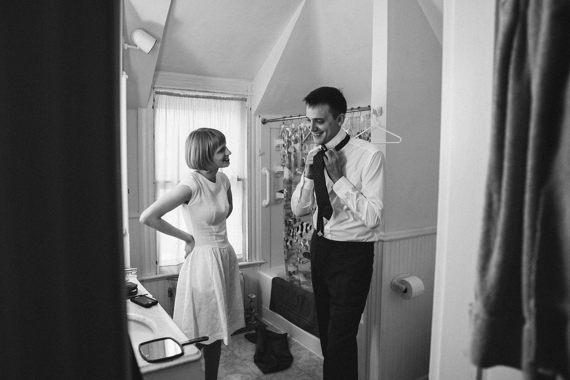 A documentary photograph featured in the best of wedding photography of 2019 showing a bride and groom getting ready together