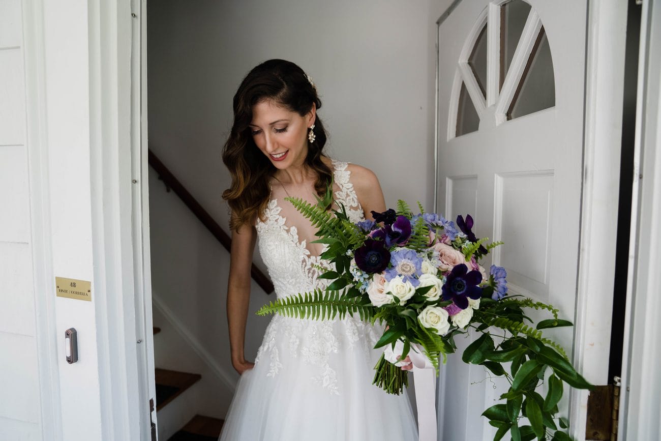 A documentary photograph featured in the best of wedding photography of 2019 showing a bride leaving her home for her wedding