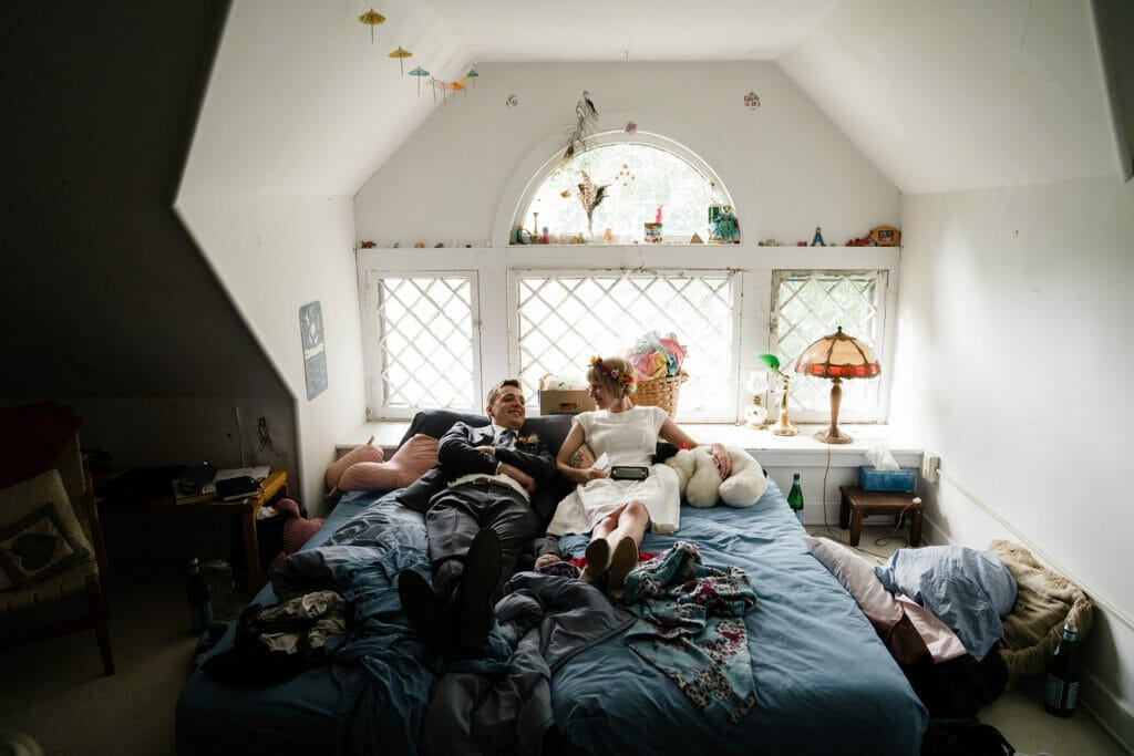 A documentary photograph featured in the best of wedding photography of 2019 showing a bride and groom hanging out a home before their c