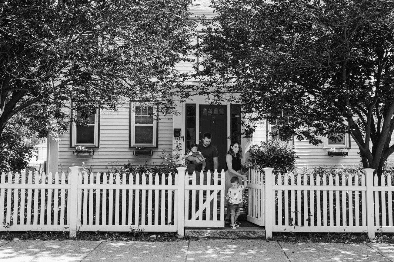 A family walking out of the home during a in home family session in Boston