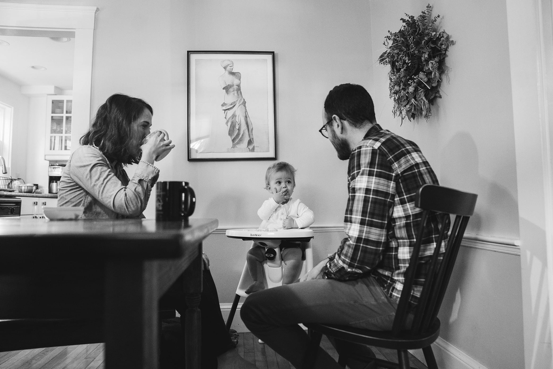 A best of Boston photograph of family eating together during their in home family session in Boston