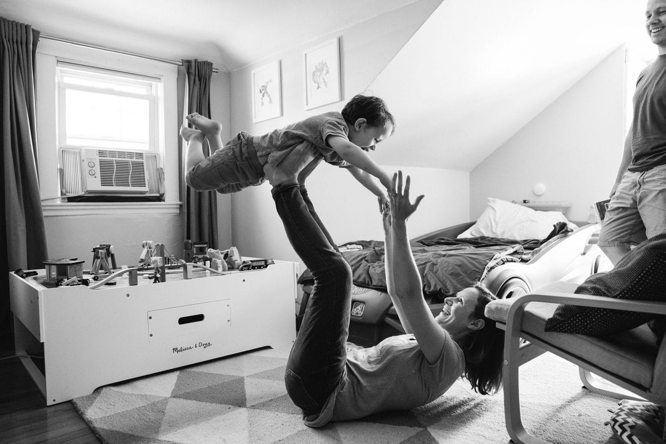 A best of Boston family photograph of mom playing with son during their in home family session in Boston