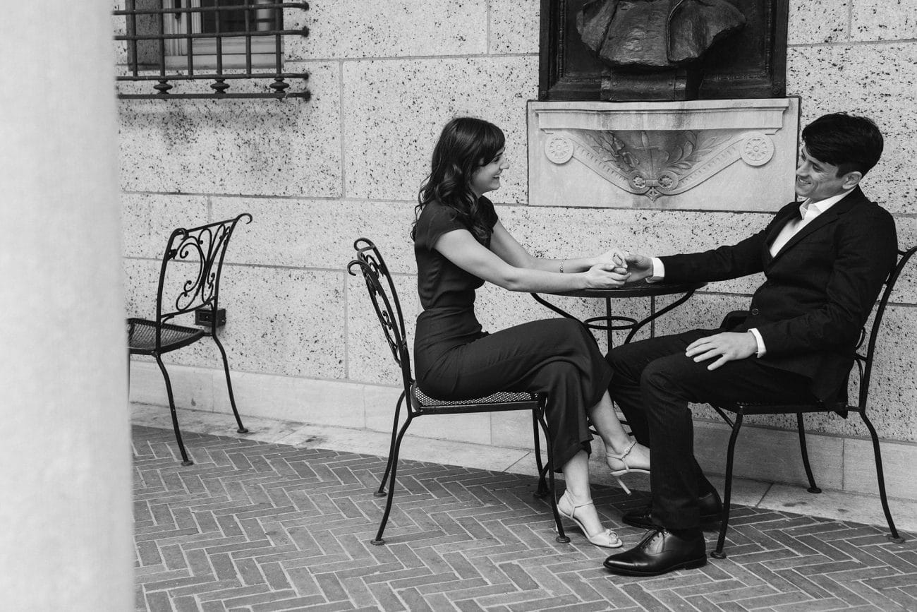 A documentary photograph of a couple sitting together in the Boston Public library 