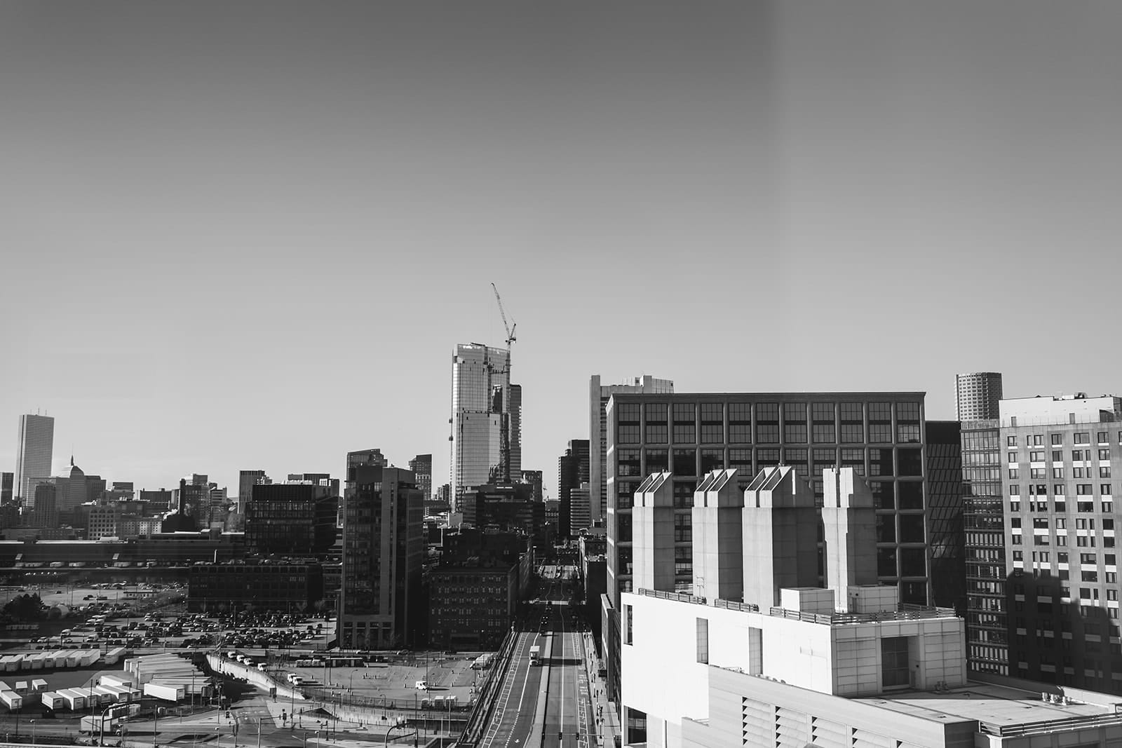 A documentary photograph of the view from Omni Seaport during the preparations of an intimate wedding at Mooo.... Seaport.