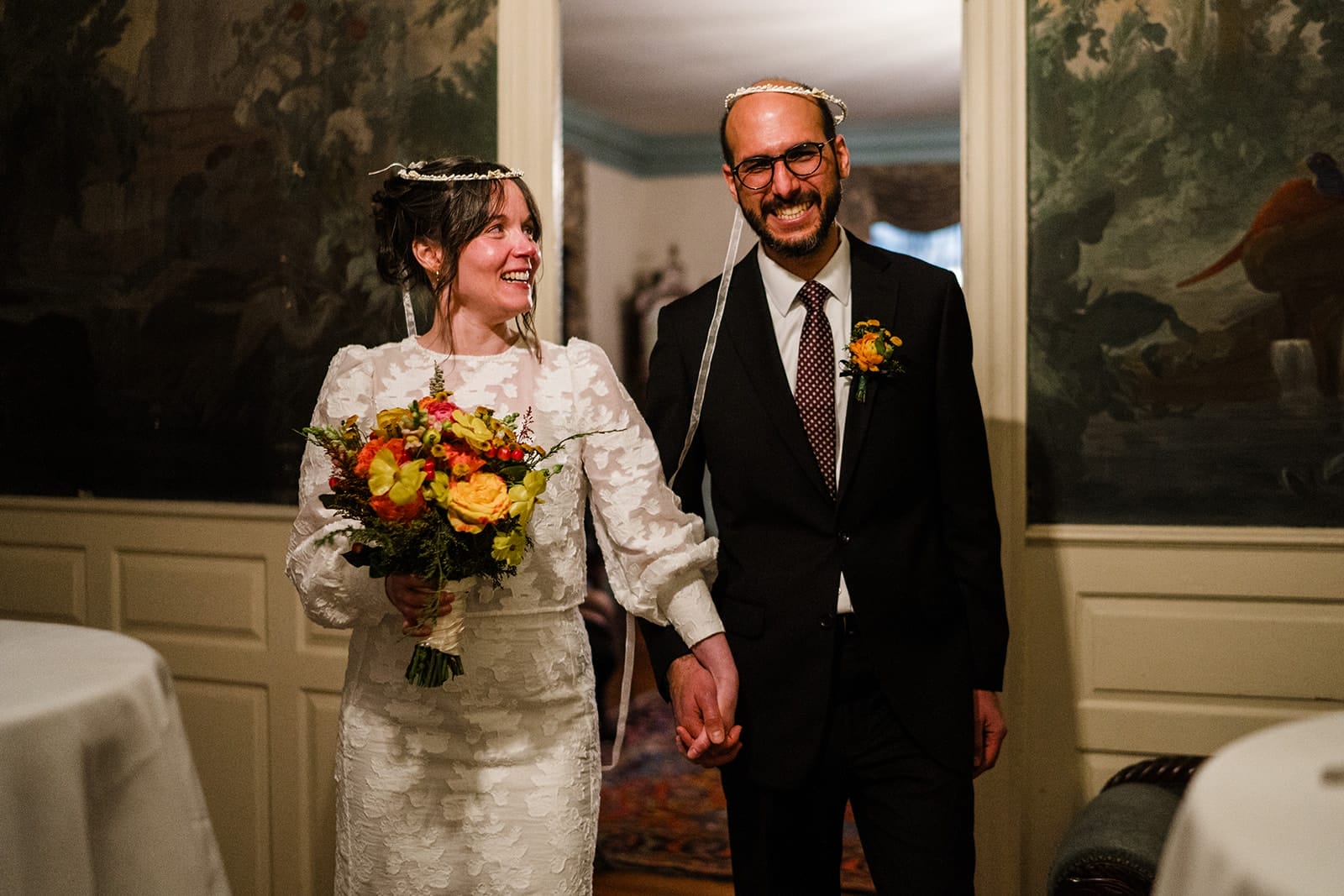 A documentary photograph of walking down the aisle during their Loring Greenough House Wedding ceremony.  