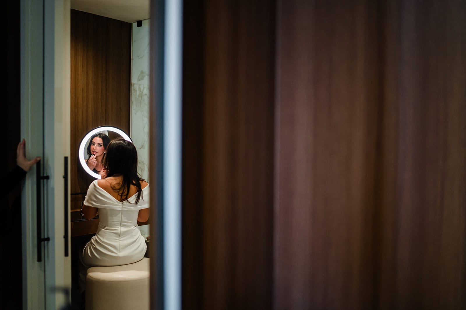 A documentary photograph of a bride getting ready at Omni Seaport before her ceremony at Boston City Hall and her intimate wedding at Mooo.... Seaport.