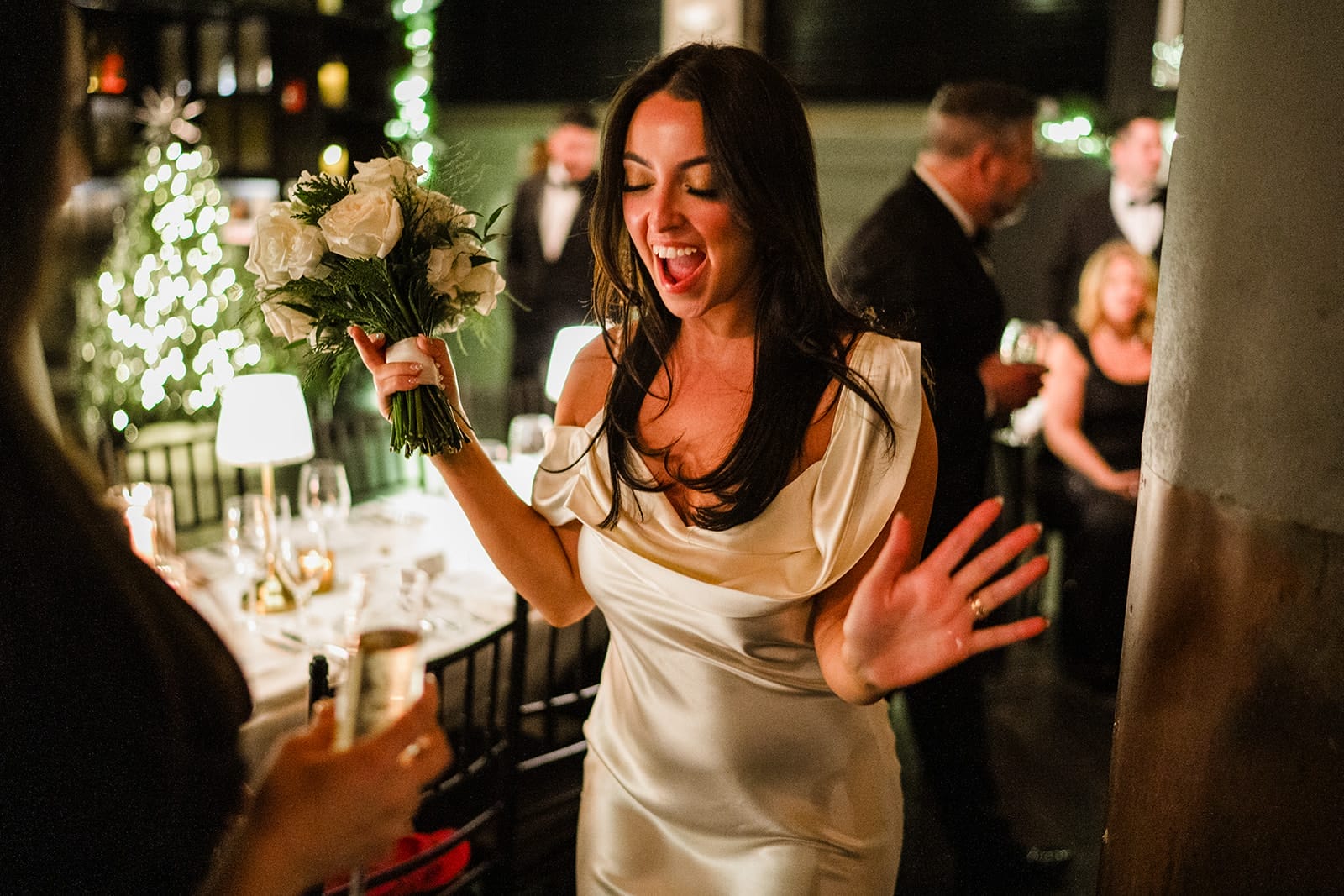 A documentary photograph of a joyful bride during theirintimate wedding at Mooo.... Seaport.