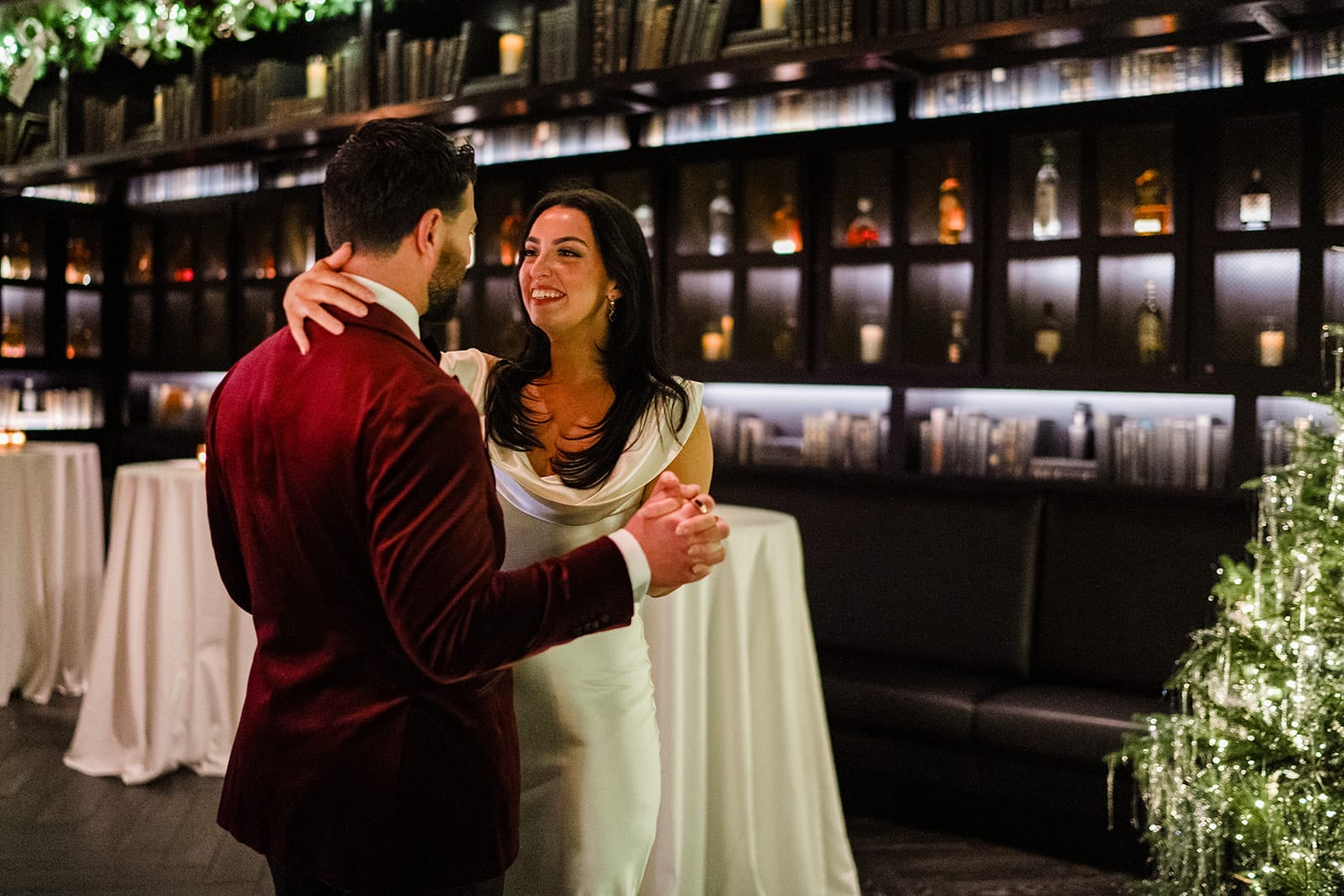 A documentary photograph of a bride and groom dancing during their wedding celebration at Mooo.... Seaport.