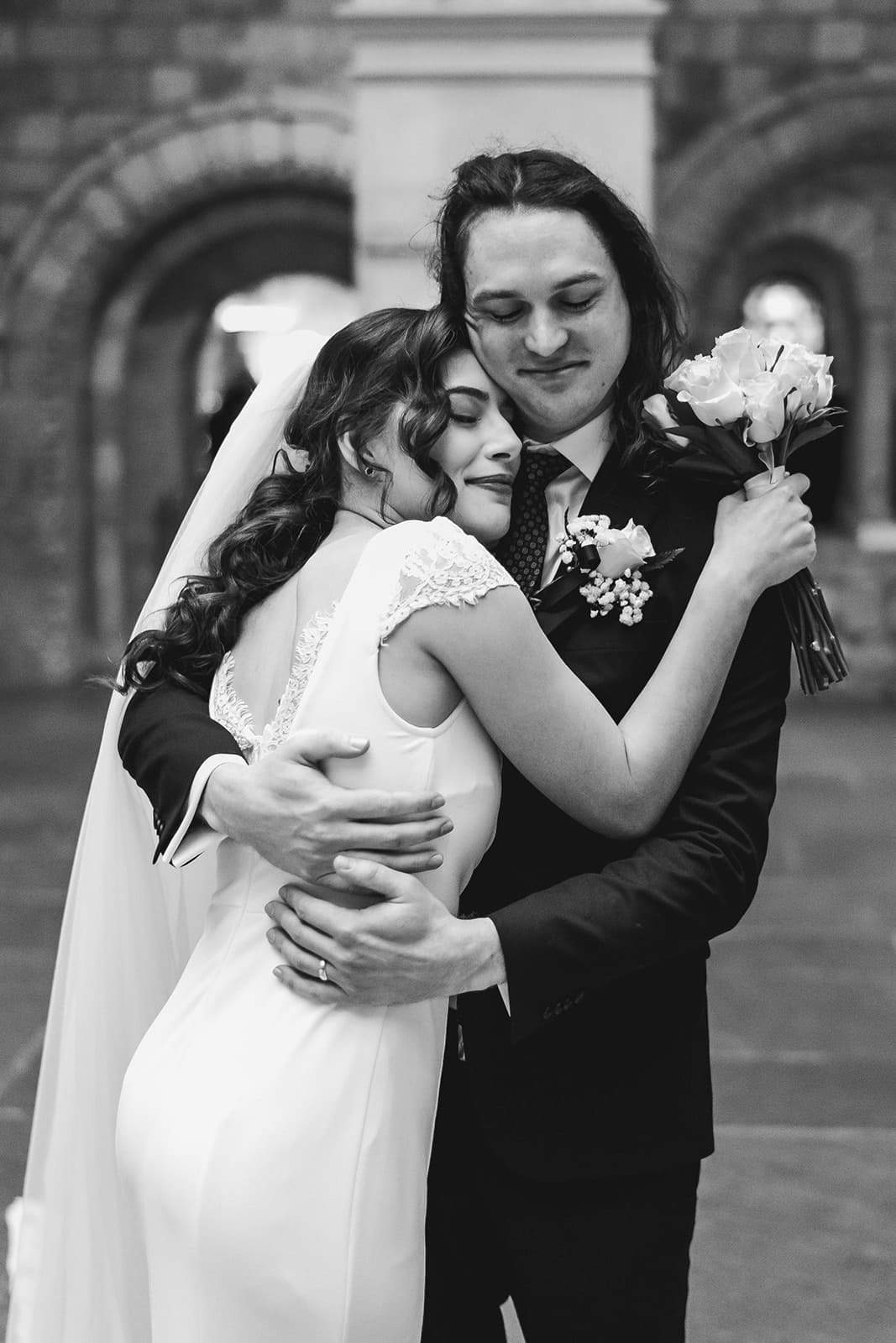 A documentary photograph of a bride and groom hugging as newly weds after their intimate Worcester Art Museum Wedding Ceremony
